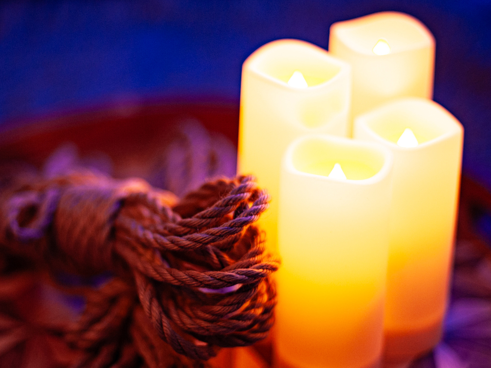 Colourful and romantic photo of jute rope and 4 candles.