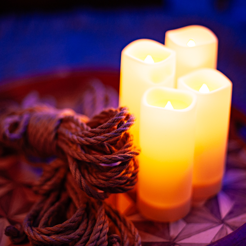 Colourful and romantic photo of jute rope and 4 candles.